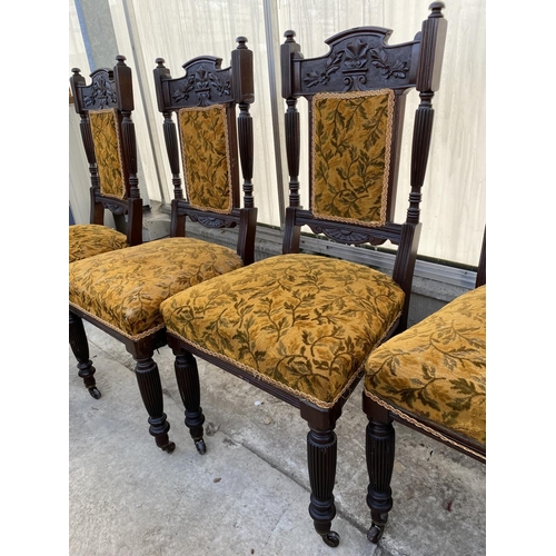 2012 - A SET OF FOUR LATE VICTORIAN SPRUNG AND UPHOLSTERED DINING CHAIRS WITH CARVED FOLIATE TOP RAIL, ON T... 