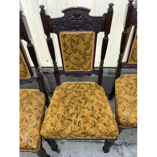 2012 - A SET OF FOUR LATE VICTORIAN SPRUNG AND UPHOLSTERED DINING CHAIRS WITH CARVED FOLIATE TOP RAIL, ON T... 