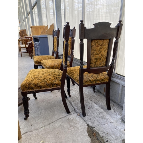 2012 - A SET OF FOUR LATE VICTORIAN SPRUNG AND UPHOLSTERED DINING CHAIRS WITH CARVED FOLIATE TOP RAIL, ON T... 