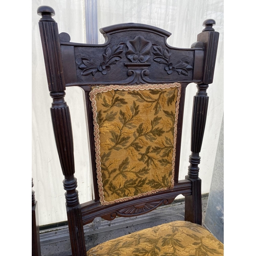 2012 - A SET OF FOUR LATE VICTORIAN SPRUNG AND UPHOLSTERED DINING CHAIRS WITH CARVED FOLIATE TOP RAIL, ON T... 