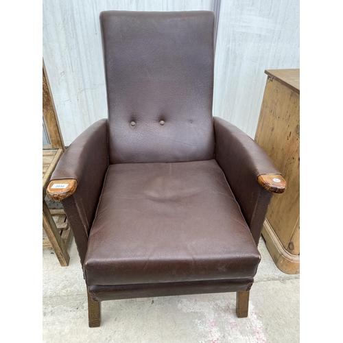 2030 - A FAUX LEATHER FIRESIDE CHAIR