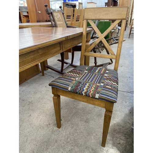 2074 - A MODERN EXTENDING DINING TABLE WITH CANTED CORNERS AND TAPERED LEGS, COMPLETE WITH ONE DINING CHAIR