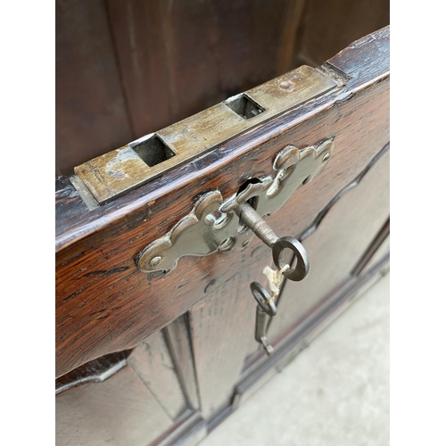 2119 - A GEORGE III OAK BLANKET CHEST WITH FOUR ARCHED PANELS AND TWO DRAWERS TO THE BASE, 54