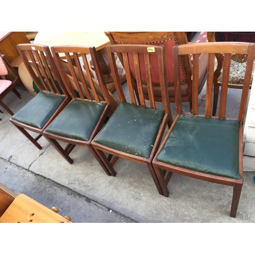 2219 - A SET OF FOUR OAK DINING CHAIRS