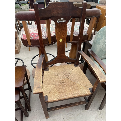 2396 - AN OAK ART NOUVEAU RUSH SEATED ELBOW CHAIR, LADDERBACK CHAIR AND DECO STYLE CHAIR