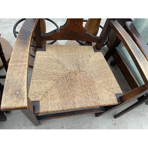 2396 - AN OAK ART NOUVEAU RUSH SEATED ELBOW CHAIR, LADDERBACK CHAIR AND DECO STYLE CHAIR