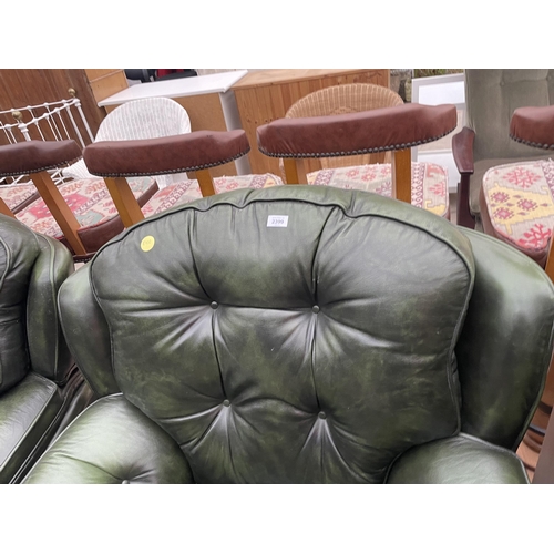 2399 - A PAIR OF GREEN LEATHER BUTTON-BACK EASY CHAIRS