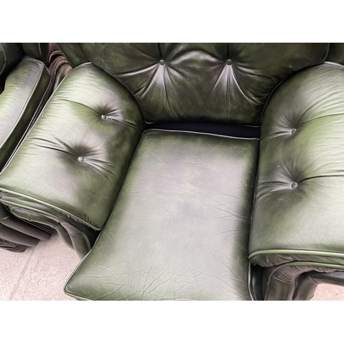 2399 - A PAIR OF GREEN LEATHER BUTTON-BACK EASY CHAIRS