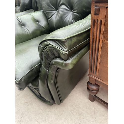 2399 - A PAIR OF GREEN LEATHER BUTTON-BACK EASY CHAIRS