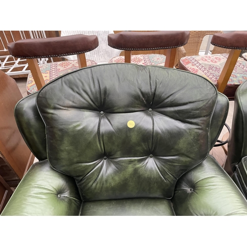 2399 - A PAIR OF GREEN LEATHER BUTTON-BACK EASY CHAIRS