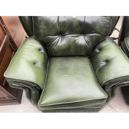 2399 - A PAIR OF GREEN LEATHER BUTTON-BACK EASY CHAIRS