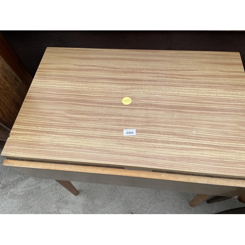 2404 - A FORMICA TOP DROP LEAF TABLE