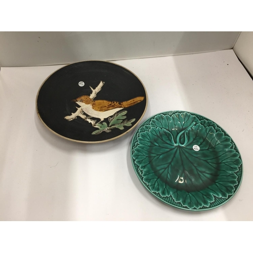 67 - TWO COLLECTABLE PLATES, ONE A GREEN WEDGWOOD CABBAGE LEAF PLUS A STUDIO POTTERY PLATE WITH A BIRD DE... 