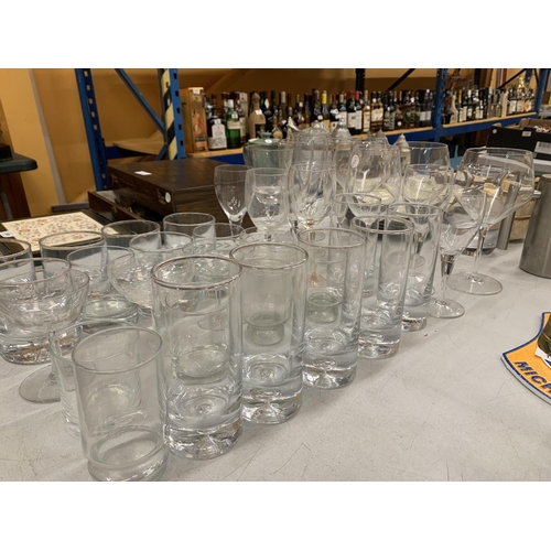 199 - A LARGE COLLECTION OF GLASSWARE INCLUDING WINE GLASSES, TUMBLERS, CHAMPAGNE COUPLES ETC.