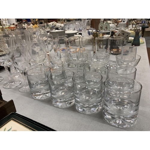 199 - A LARGE COLLECTION OF GLASSWARE INCLUDING WINE GLASSES, TUMBLERS, CHAMPAGNE COUPLES ETC.