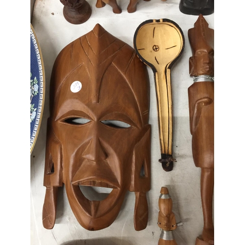 278A - A QUANTITY OF TREEN ITEMS TO INCLUDE AFRICAN MASKS, FIGURES, BOX, COASTERS, ETC
