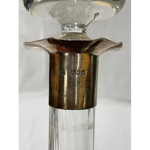 15 - AN UNUSUAL GLASS DECANTER WITH A HALLMARKED LONDON SILVER COLLAR