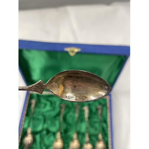 19 - A BOXED SET OF SIX DECORATIVE SPOONS MARKED 800