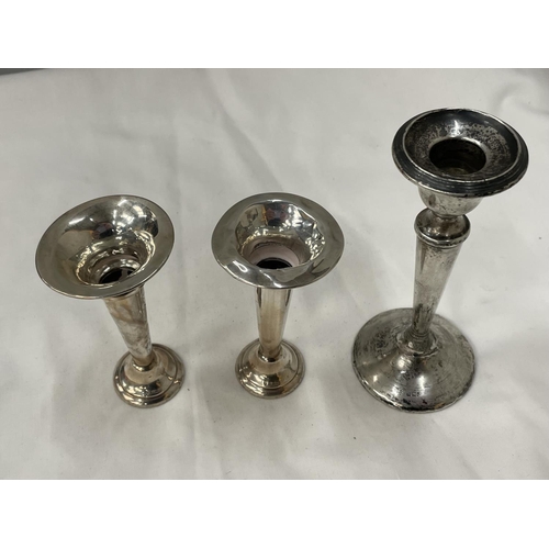 22 - THREE HALLMARKED BIRMINGHAM SILVER ITEMS TO INCLUDE A CANDLESTICK AND A PAIR OF BUD VASES