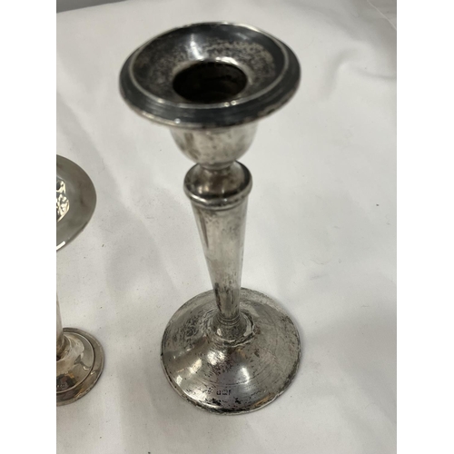 22 - THREE HALLMARKED BIRMINGHAM SILVER ITEMS TO INCLUDE A CANDLESTICK AND A PAIR OF BUD VASES