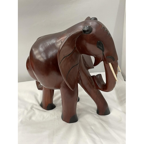 34 - A LARGE HARDWOOD ELEPHANT MODEL HEIGHT 38CM