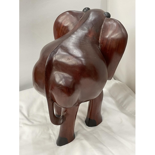 34 - A LARGE HARDWOOD ELEPHANT MODEL HEIGHT 38CM