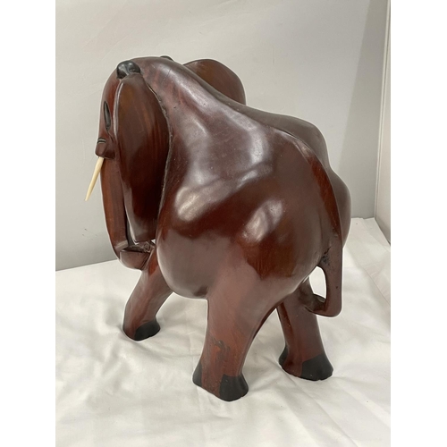 34 - A LARGE HARDWOOD ELEPHANT MODEL HEIGHT 38CM