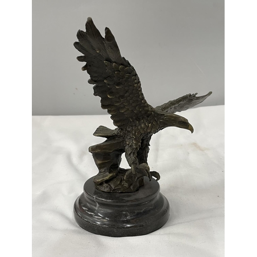 36A - A BRONZE EAGLE ON A MARBLE BASE HEIGHT 18.5CM TO TIP OF WING