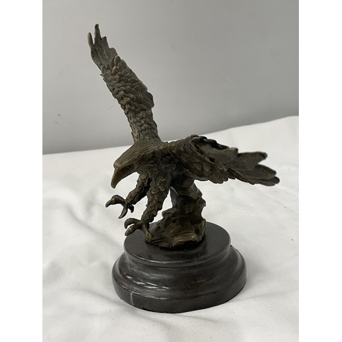 36A - A BRONZE EAGLE ON A MARBLE BASE HEIGHT 18.5CM TO TIP OF WING