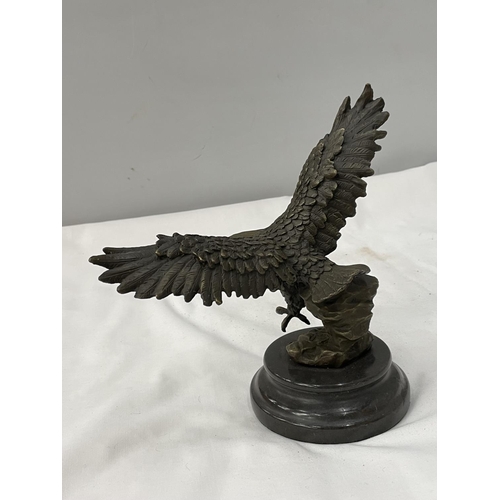 36A - A BRONZE EAGLE ON A MARBLE BASE HEIGHT 18.5CM TO TIP OF WING