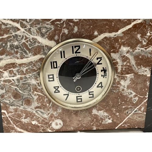 39 - A MARBLE CLOCK WITH GARNITURES IN AN ART DECO STYLE