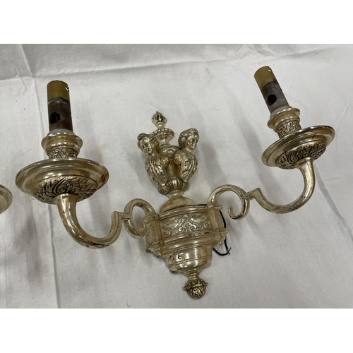 45 - A PAIR OF WHITE METAL DOUBLE WALL LIGHTS WITH CHERUB STYLE DESIGN