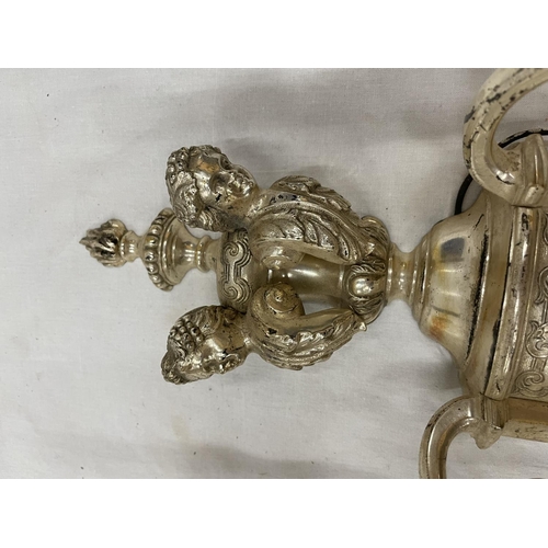 45 - A PAIR OF WHITE METAL DOUBLE WALL LIGHTS WITH CHERUB STYLE DESIGN