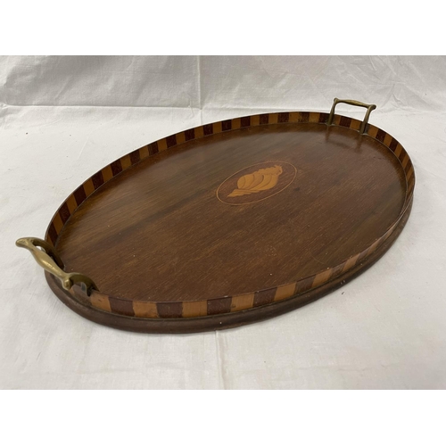 50 - A LARGE MAHOGANY TRAY WITH BRASS HANDLES AND A SHELL DESIGN 57CM X 37CM