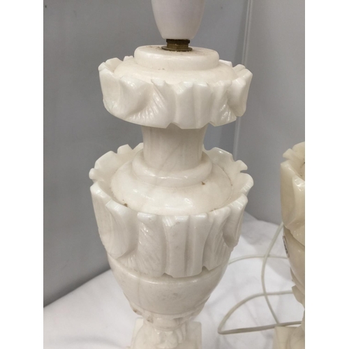 55 - A PAIR OF CARVED WHITE MARBLE TABLE LAMPS