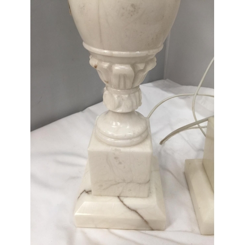 55 - A PAIR OF CARVED WHITE MARBLE TABLE LAMPS