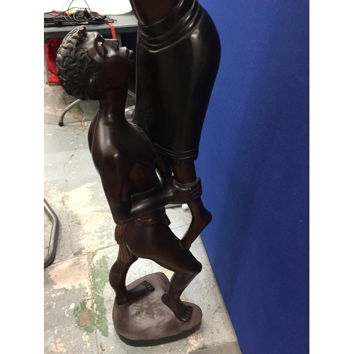 60A - A CARVED HARDWOOD TRIBAL STATUE OF A MAN LIFTING A WOMEN HEIGHT 167CM