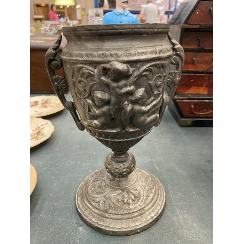 78 - A VICTORIAN CAST IRON EMBOSSED POT HEIGHT 23CM