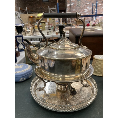 83 - A SILVER PLATED SPIRIT KETTLE ON A TRAY