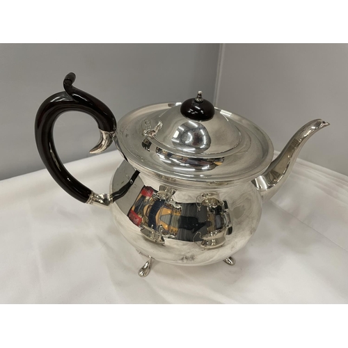 1 - A THREE PIECE HALLMARKED BIRMINGHAM SILVER TEA SET TO INCLUDE A TEAPOT, TWIN HANDLED SUGAR BOWL AND ... 