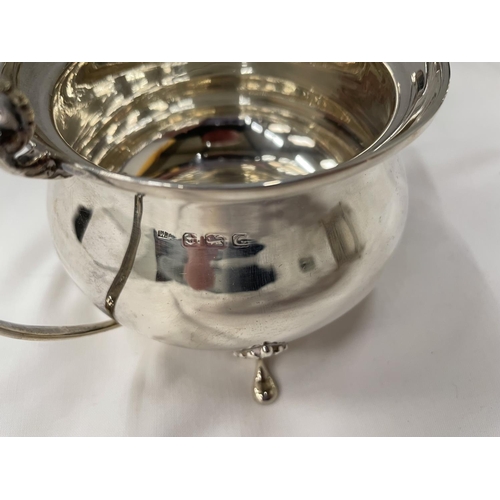 1 - A THREE PIECE HALLMARKED BIRMINGHAM SILVER TEA SET TO INCLUDE A TEAPOT, TWIN HANDLED SUGAR BOWL AND ... 