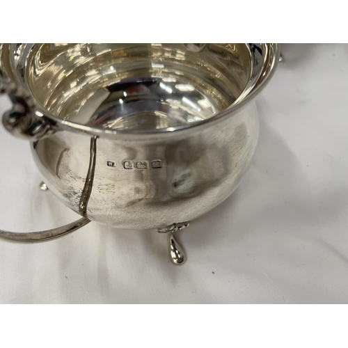 1 - A THREE PIECE HALLMARKED BIRMINGHAM SILVER TEA SET TO INCLUDE A TEAPOT, TWIN HANDLED SUGAR BOWL AND ... 