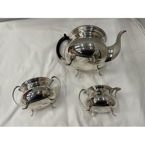 1 - A THREE PIECE HALLMARKED BIRMINGHAM SILVER TEA SET TO INCLUDE A TEAPOT, TWIN HANDLED SUGAR BOWL AND ... 