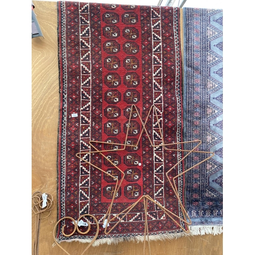 1993 - A RED PATTERNED FRINGED RUG