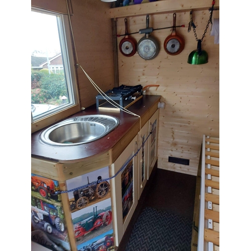 174 - A SHEPHERD'S HUT ON A MASSEY FERGUSON TIPPER TRAILER CHASSIS FULLY LINED WITH STOVE SINK TOILET SING... 