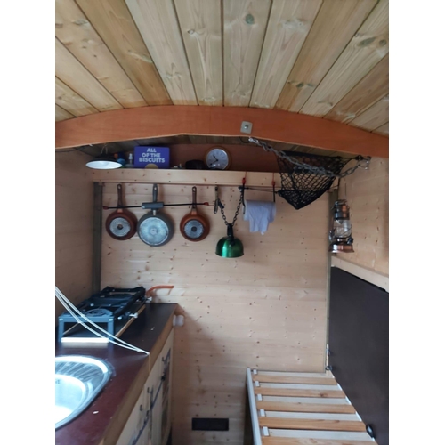 174 - A SHEPHERD'S HUT ON A MASSEY FERGUSON TIPPER TRAILER CHASSIS FULLY LINED WITH STOVE SINK TOILET SING... 