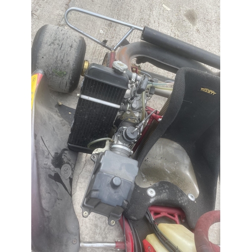 119 - A RACING GO KART WITH ROLSON ENGINE WHICH HAS DONE APPROX 4 HOURS ONLY IT IS GOVERNED FOR JUNIOR RAC... 