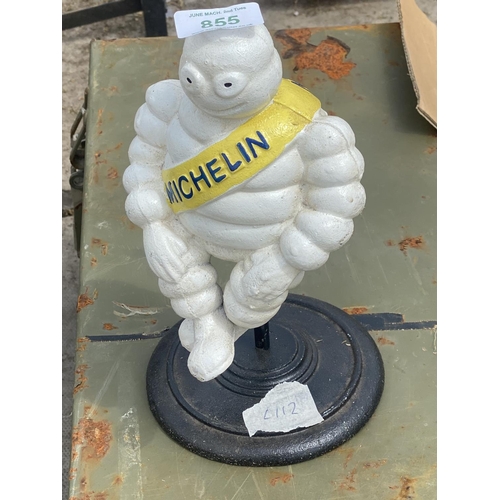 855 - CAST IRON MICHELIN MAN ON STAND  +  VAT