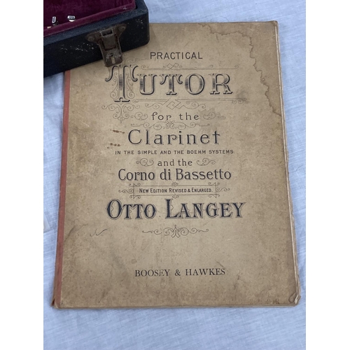 39 - A BOXED BOOSEY AND HAWKES CLARINET 77 BOEHM SYSTEM WITH SPARE REEDS AND 'PRACTICAL TUTOR FOR THE CLA... 