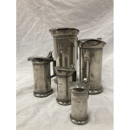 10 - A SET OF FIVE PEWTER GRADUATING MEASURING LIDDED JUGS MEASURING FROM LITRE TO DEMI-DECILITRE WITH TO... 